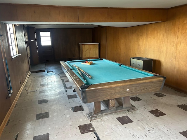 rec room featuring light floors, pool table, and wood walls