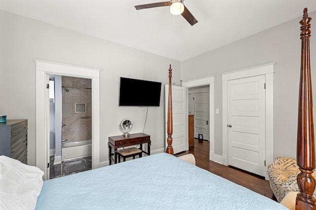 bedroom with ensuite bath, ceiling fan, baseboards, and dark wood finished floors