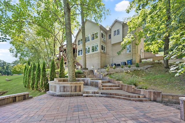 surrounding community featuring a patio and stairway