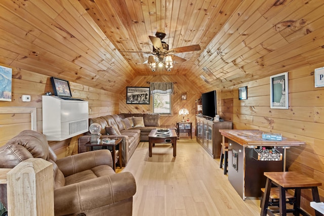 living room with lofted ceiling, wooden ceiling, wood walls, wood finished floors, and a ceiling fan