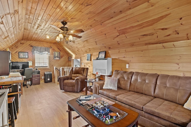 living room featuring wooden walls, a ceiling fan, lofted ceiling, wood ceiling, and light wood-style flooring