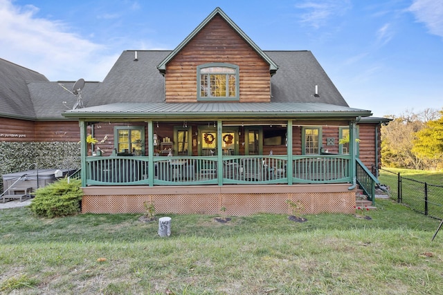 view of front of home featuring a porch, a front yard, and fence