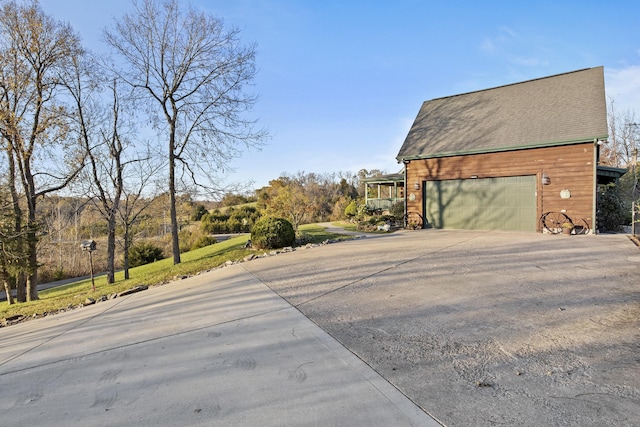 view of side of property with a garage