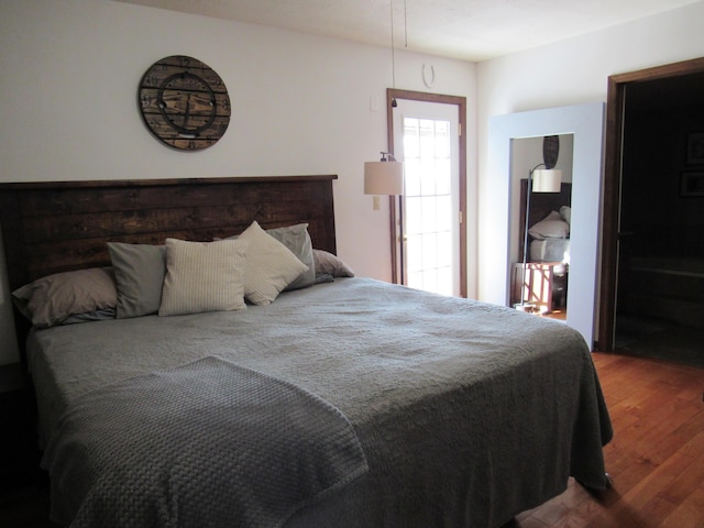 bedroom featuring wood finished floors