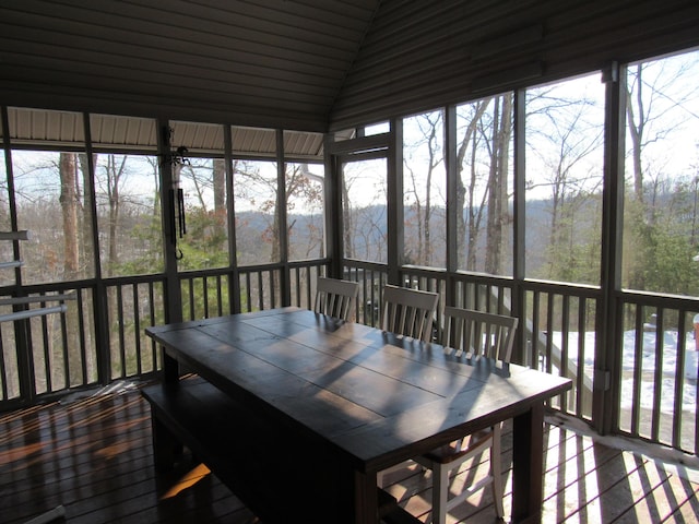 sunroom / solarium with vaulted ceiling