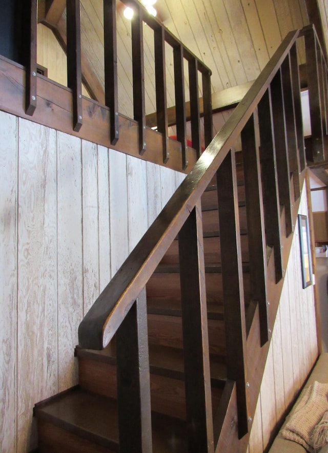 stairs with wood ceiling