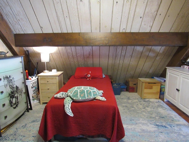 bedroom with vaulted ceiling with beams, wood ceiling, and wood walls