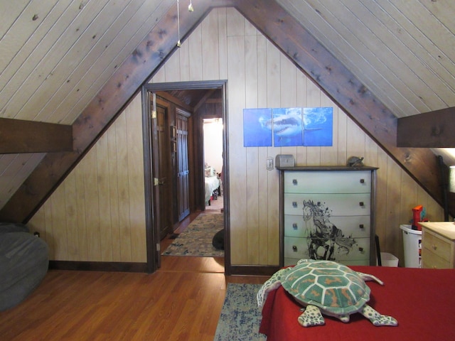 bedroom featuring wood ceiling, vaulted ceiling with beams, wood walls, and wood finished floors