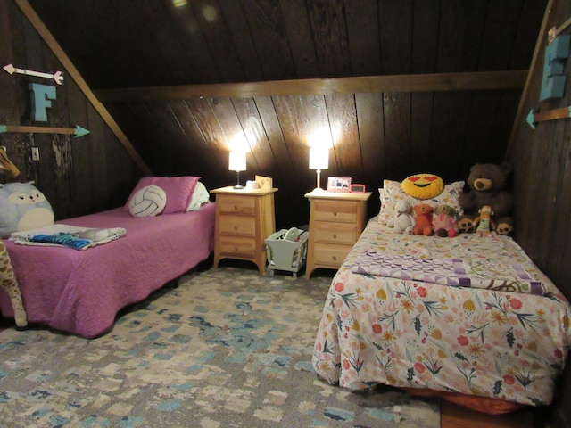 bedroom with carpet and wooden walls