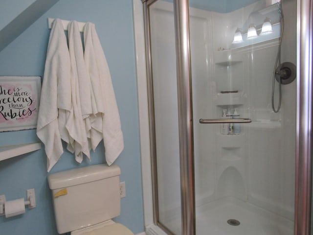 full bath with a stall shower and toilet