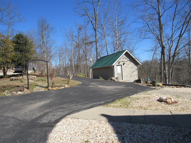 view of street with aphalt driveway