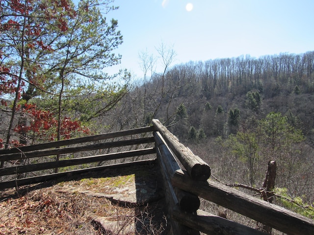 exterior space with a wooded view