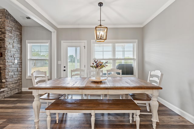 dining space featuring crown molding, baseboards, dark wood-style floors, and visible vents