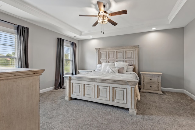 bedroom featuring baseboards, recessed lighting, light carpet, and a tray ceiling