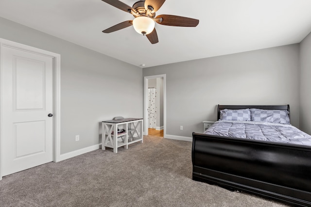 carpeted bedroom with baseboards and a ceiling fan