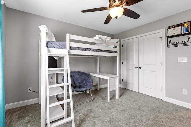 bedroom featuring a closet, baseboards, a ceiling fan, and carpet