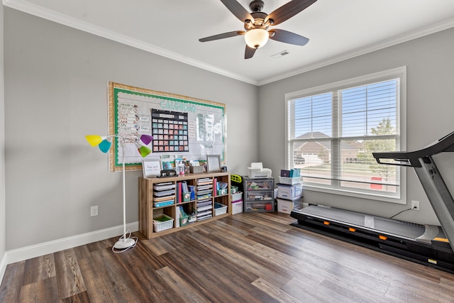 exercise area featuring baseboards, wood finished floors, visible vents, ornamental molding, and a ceiling fan