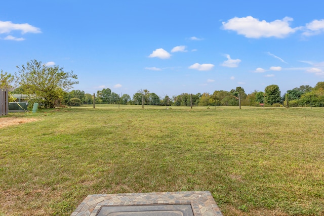 view of yard with a rural view