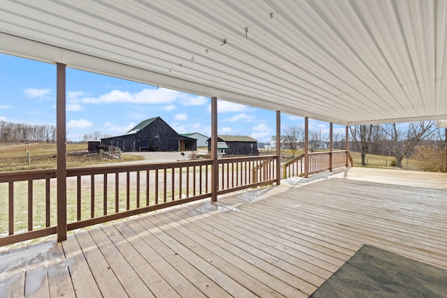 deck with an outbuilding and a barn