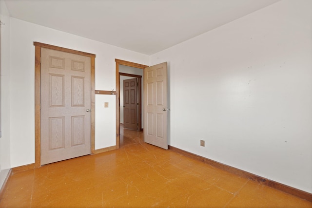 unfurnished bedroom featuring baseboards