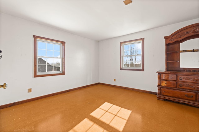 unfurnished bedroom featuring baseboards