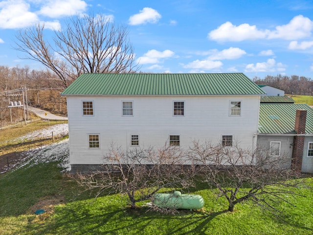 view of property exterior featuring metal roof