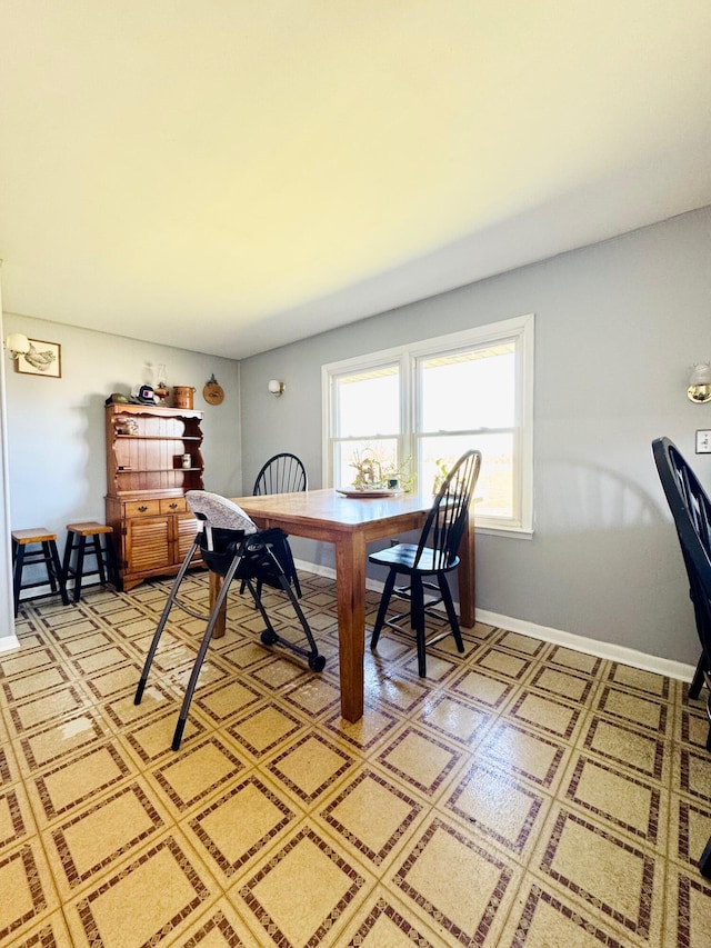 dining space with baseboards