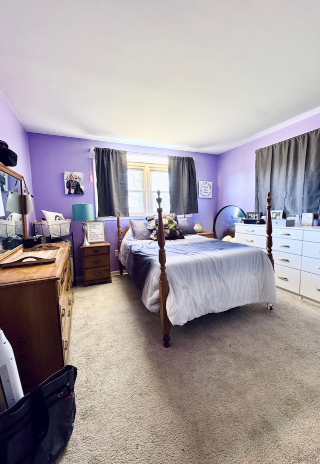 bedroom featuring light carpet