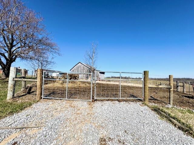 view of gate featuring fence