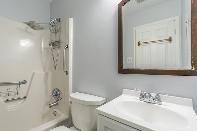 bathroom featuring toilet, shower / washtub combination, and vanity