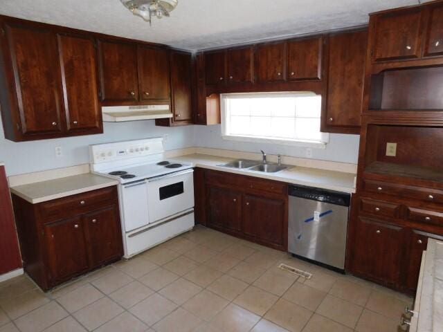 kitchen with under cabinet range hood, a sink, light countertops, stainless steel dishwasher, and white range with electric cooktop