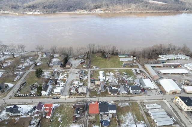 drone / aerial view featuring a residential view and a water view