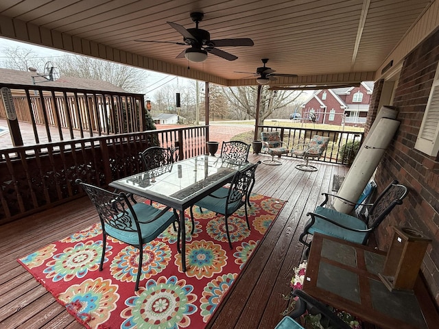 deck with ceiling fan and outdoor dining space