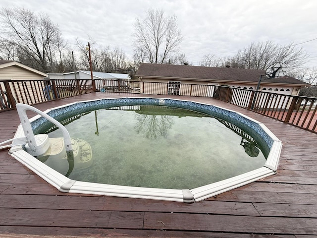 outdoor pool with a deck