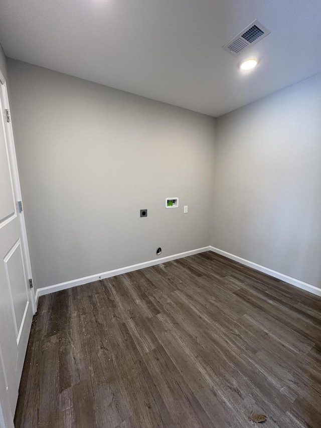 laundry area featuring laundry area, visible vents, dark wood-style floors, hookup for a washing machine, and hookup for an electric dryer