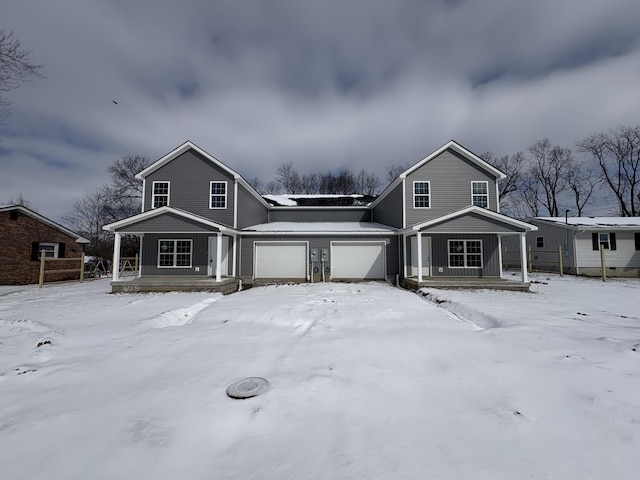 view of front of property with a garage and covered porch