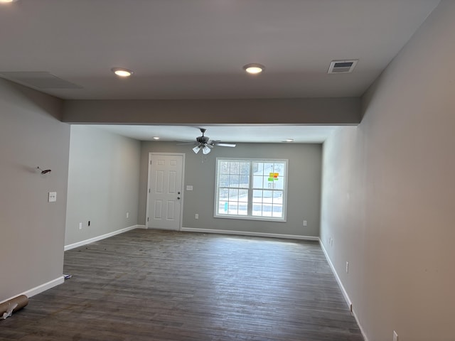 unfurnished room with baseboards, visible vents, ceiling fan, dark wood-type flooring, and recessed lighting