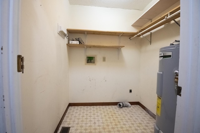 clothes washing area with laundry area, visible vents, water heater, tile patterned floors, and electric dryer hookup