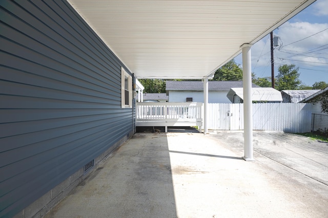 view of patio / terrace featuring fence and a wooden deck