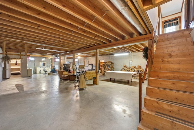 basement with stairway and a wealth of natural light