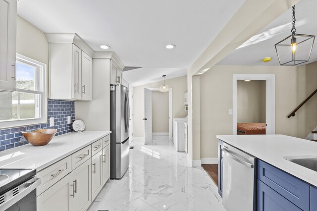 kitchen featuring pendant lighting, light countertops, and stainless steel appliances