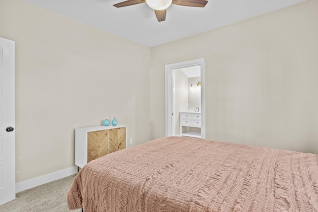 bedroom featuring light colored carpet, ceiling fan, and baseboards