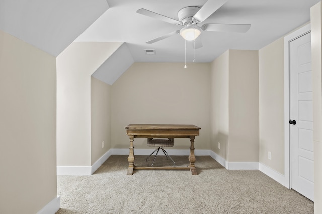 home office featuring baseboards, visible vents, a ceiling fan, vaulted ceiling, and carpet floors