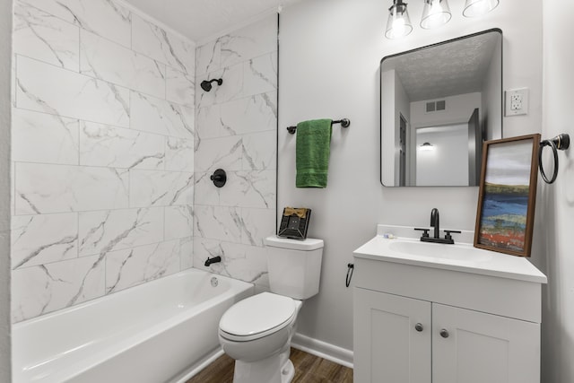 bathroom with bathing tub / shower combination, visible vents, toilet, vanity, and wood finished floors