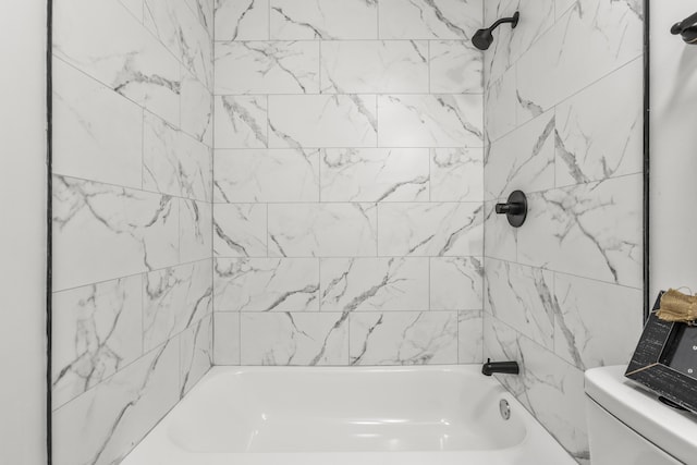 bathroom featuring toilet and shower / bathtub combination