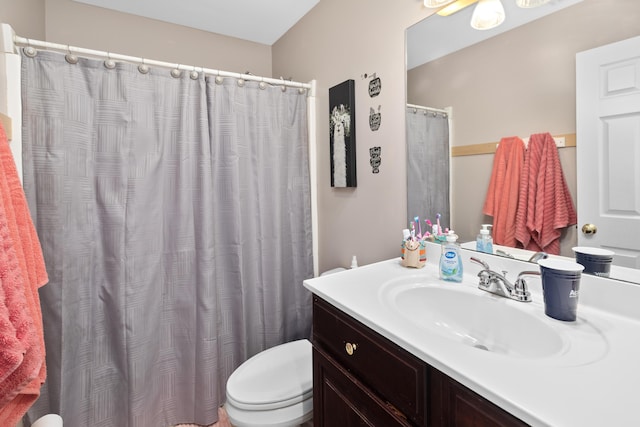 full bathroom with toilet, a shower with shower curtain, and vanity