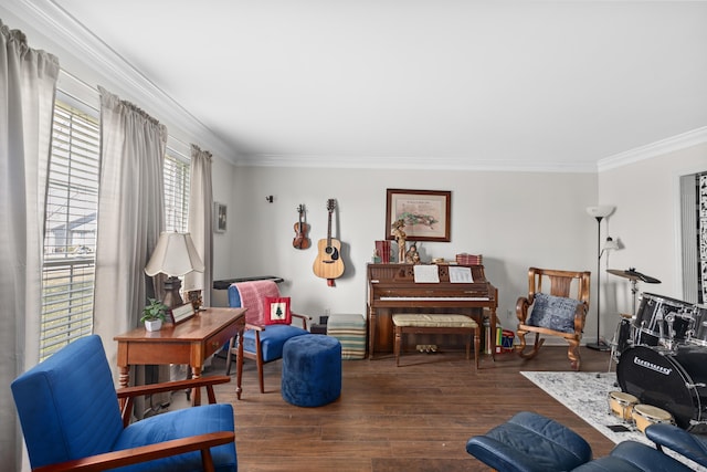 living area with crown molding and wood finished floors