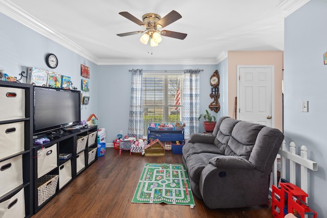 living area with crown molding, a ceiling fan, and wood finished floors