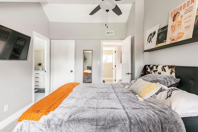 bedroom with ceiling fan, baseboards, visible vents, and connected bathroom