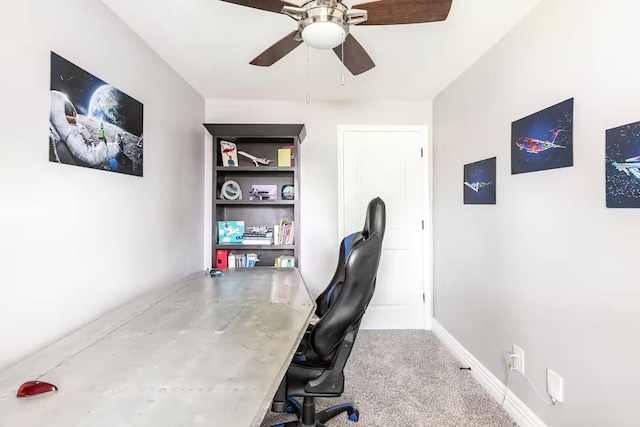 home office with carpet flooring, baseboards, and ceiling fan